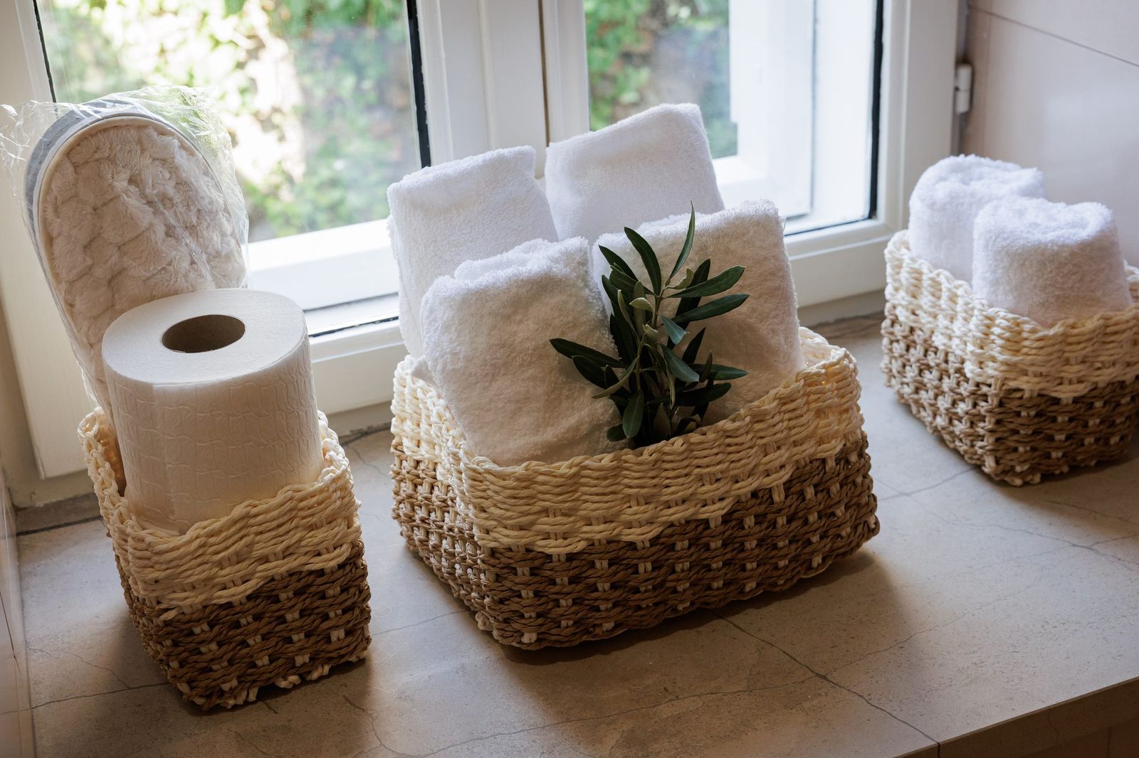 Detail of towels and toiletries in the bathroom baskets